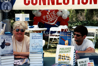 Patricia Nell Warren selling books at Pride festival, 2000