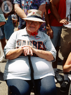 Seated woman at Pride festival, 1998