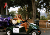 Kate Johnson on golf cart at Pride festival, 1998