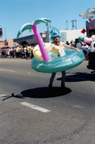 Marcher in inflatable costume in Pride parade, 1999