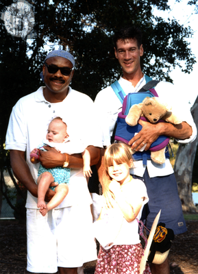 Two men with two children, family at Pride parade, 1996