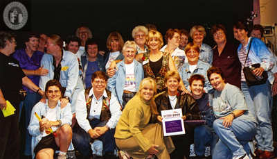 Patty Morton and Dawn Sitler with a group onstage at Pride Rally, 2001