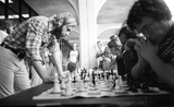 Students play chess outside Love Library, 1975