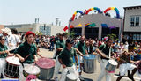 Marchers drumming at Pride parade, 1998