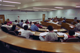 Students and instructor in lecture hall, 1996