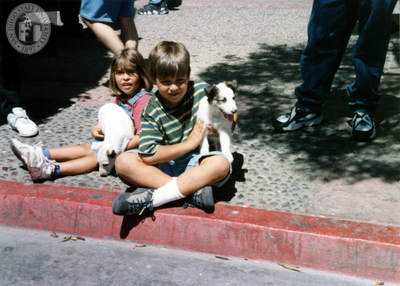 Children sitting on sidewalk for Tijuana Pride parade, 1996