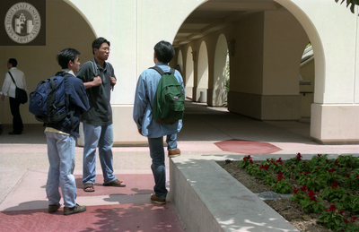 Students chatting near Student Services West, 1999