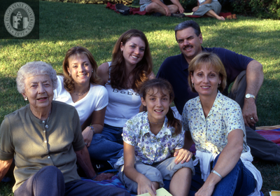Family on the grass at Family Weekend, 2000