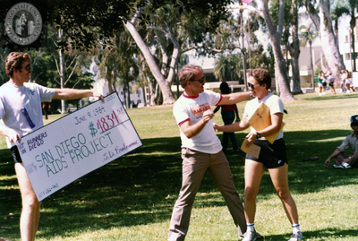 Jim Ellis presents check to SD Aids Project, 1984