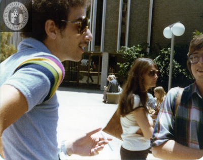 Two individuals conversing at Civic Center demonstration, 1977