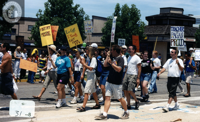 Teachers marching with signs in Pride parade, 2000