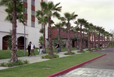 Students on walkway past dormitories, 1999