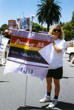 Debbie Zierman with 1988 parade theme flag, 1992