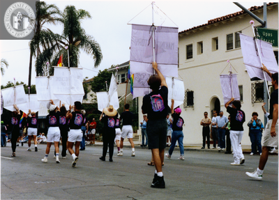 Lesbian and Gay Archives marchers with banners in Pride parade, 1990