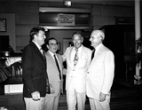 Lionel Van Deerlin with unidentified men outside a cafeteria