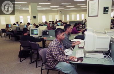 Students use computers in the library, 1998