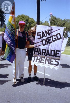 Doug Moore with a rainbow flag in the Pride parade, 1992