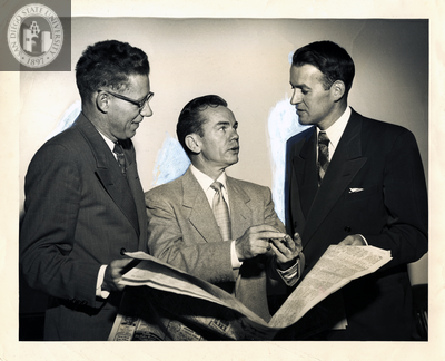 Lionel Van Deerlin stands with two unidentified men in suits