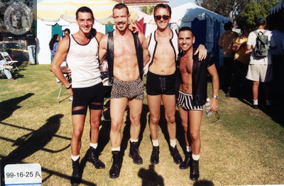 Four men in short shorts backstage at Pride Festival, 1999