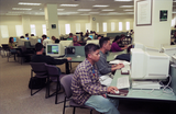 Students use computers in the library, 1998