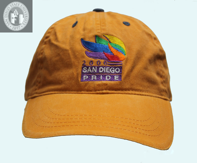 "San Diego Pride, 2006" with a torch on a baseball cap