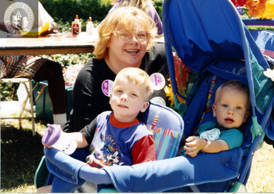 Two children in stroller with woman at For the Children, 1996