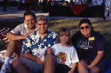 Family sitting on lawn at Family Weekend, 2000