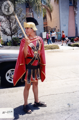 Person in Spartan warrior costume at Pride parade, 2000