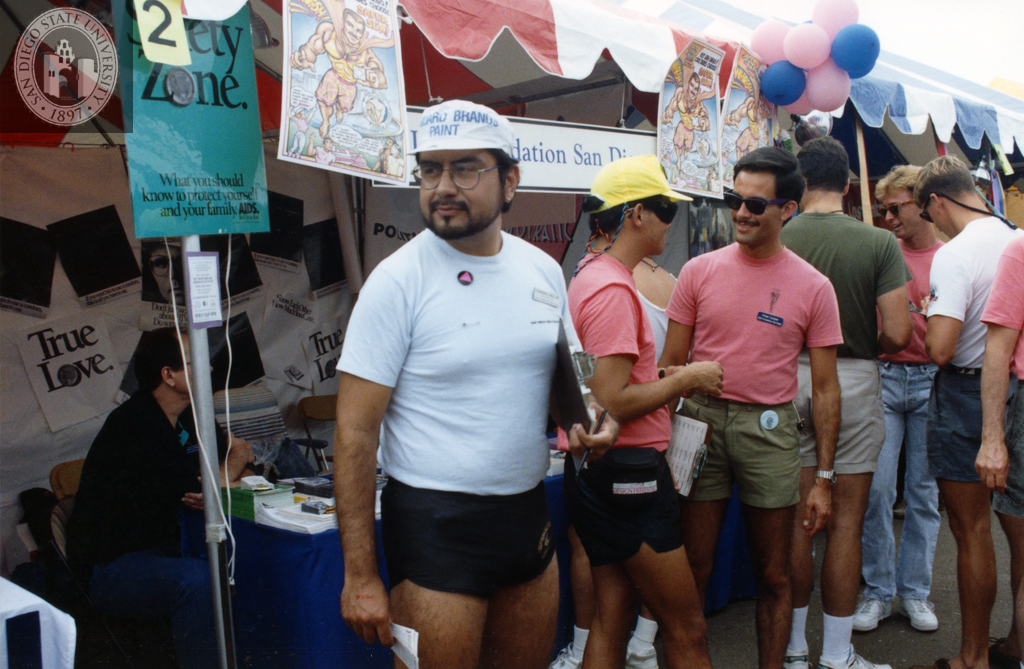 Peter Cooper and others in front of AIDS Foundation of San Diego booth, 1991