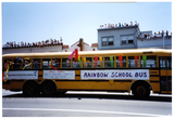 People in "Rainbow school bus" in Pride parade, 1999