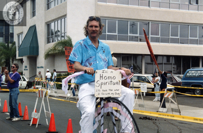 Albert Bell rides on a decorated penny farthing in Pride Parade, 1991
