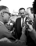 Lionel Van Deerlin with Hubert Humphrey and press