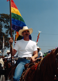 Rodeo Pride participant on horseback at Pride parade, 1998