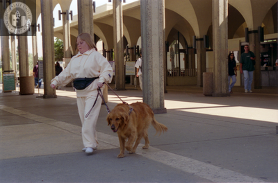 Woman and guide dog at Aztec Center, 1996