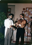 Jim Knight receives trophy for being chosen Mr. Sandie, 1982