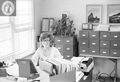 An unidentified woman at her desk