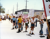Marchers holding signs at Pride parade, 1978