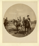 Four uniformed men on horseback