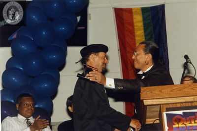 Kenny Ard receiving an Out & Free award at San Diego Pride, 1995
