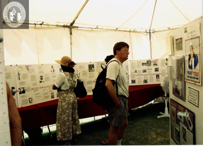 Attendees in LGHSSD booth at Pride festival, 1993