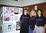 Lambda Archives volunteers in front of display board at Pride festival, 1988