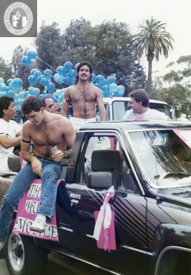 People riding in back of truck in Pride parade, 1988