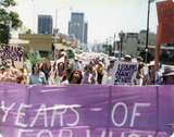 "Lesbians against Senate Bill S-1" behind banner at Pride parade, 1976