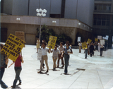 Picket line walking forward at Civic Center demonstration, 1977