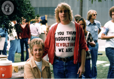 Man in "If you think faggots are revolting we are" shirt at Pride parade, 1975