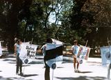 Lambda Archives participants holding signs in Pride parade