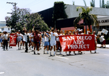 Marchers holding "San Diego AIDS Project" banner at Pride parade