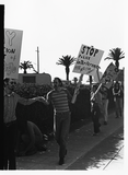 Stephen Bell holds a man's hand, Gay Liberation Front picket at SDPD, 1971