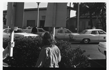Picketer looks across street at SDPD, Gay Liberation Front picket, 1971