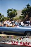 Participants waving from The Center North County car at Pride parade, 1998